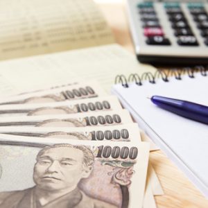 Saving account passbook Japanese Yen notebook calculator