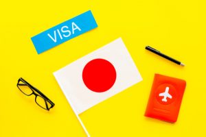 Visa To Japan Concept. Text Visa Near Passport Cover And
