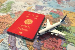 Japanese Passport And An Airplane On World Map 3d Illustration