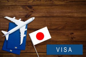 Immigration To Japan Concept. Text Immigration Near Passport Cover And