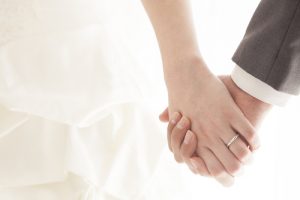 Young Married Couple Holding Hands  Ceremony Wedding Day