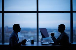 Outlines,Of,Two,Businessmen,Working,Late,In,Office