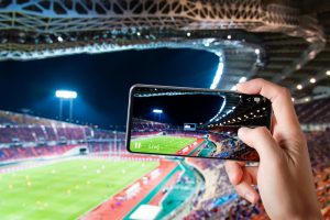 Hands,Use,Smartphones,Record,Soccer,Competition,Match,In,Football,Stadium