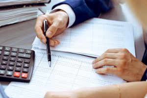 Bookkeeper,Or,Financial,Inspector,And,Secretary,Making,Report,,Calculating,Or