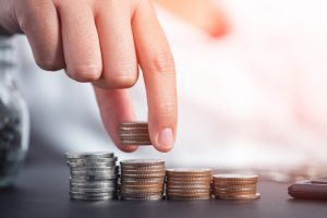Close,Up,Female,Hand,Stacking,Coins,And,Counting,On,The